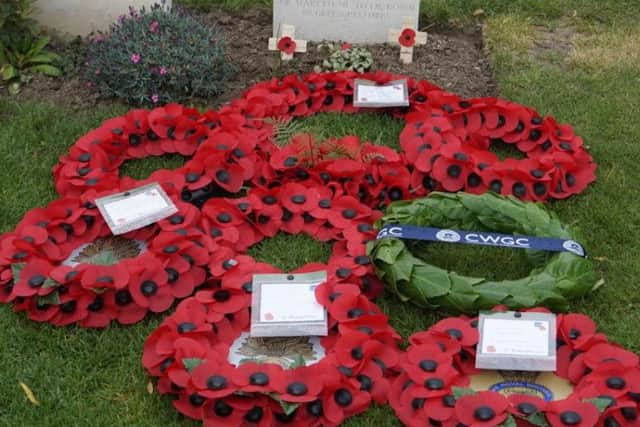 Wreaths lie in front of Pte Fosketts headstone, Crown Copyright, All rights reserved.