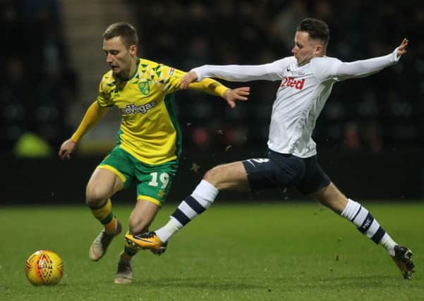 Preston North End's Alan Browne battles with  Norwich City's Tom Trybull