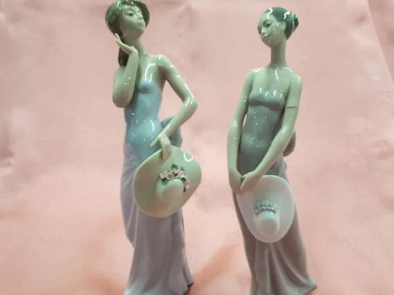 From  the elegant lady series, the coquette figurine on the left  is 48 pounds
