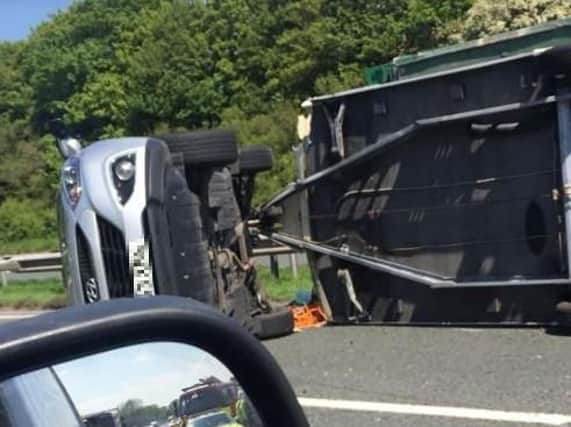 An overturned caravan on the M6.