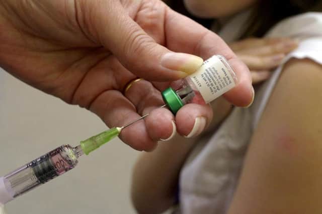 A measles vaccination being administered. Experts have said the UK should consider introducing compulsory measles vaccinations before children can start school.