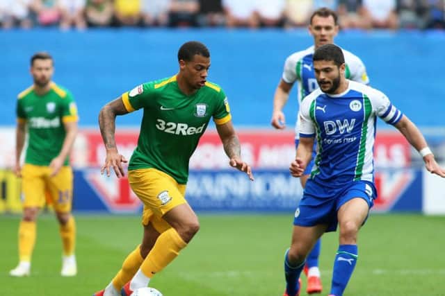 Lukas Nmecha makes one of the many dribbles he did in a Preston shirt
