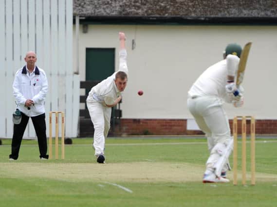 Leyland bowler Ross Bretherton sends down a delivery against Chorley at Fox Lane