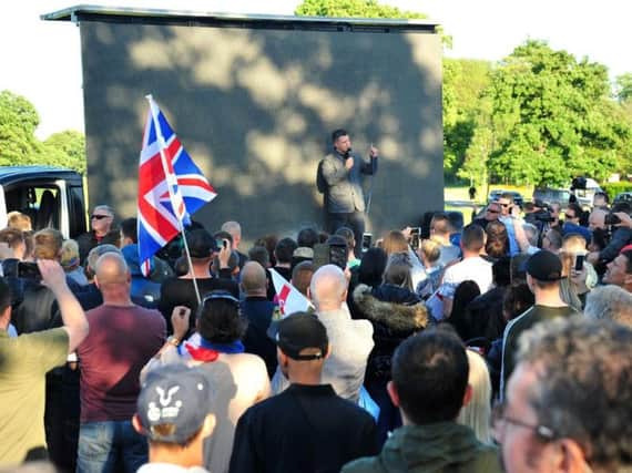 Stephen Yaxley-Lennon, known as Tommy Robinson, gives a speech in Ashton Park, Preston on Monday, May 20.