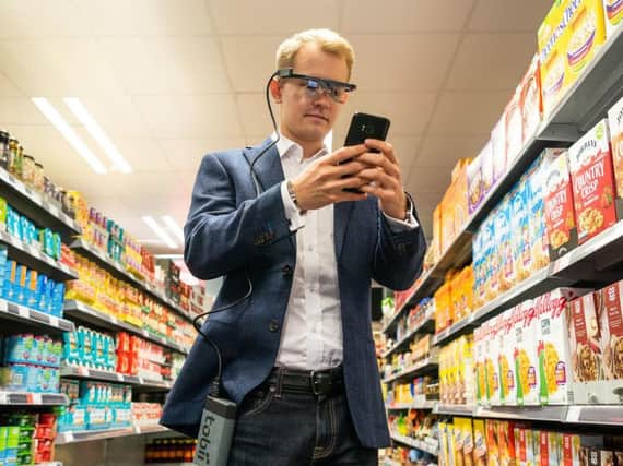 University of Bath of Dr Carl-Philip Ahlbom, wearing eye-tracking glasses to help conduct a study into how mobile phone use affects our spending in supermarkets - the study found it pushes up shopping bills by 41% on average.