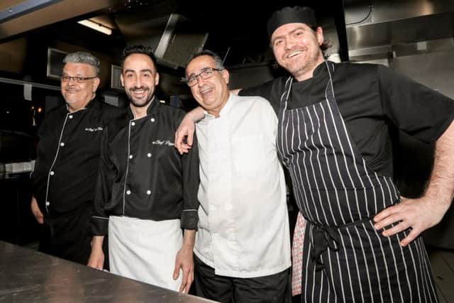 Cooking up a storm: Chef Lima (far left) with Head Chef Peppe (second from left) with other members of the kitchen staff.