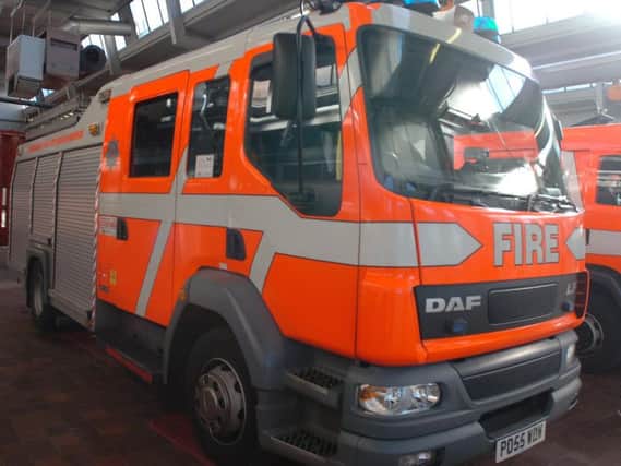 Firefighters cut one person from a car following a road collision