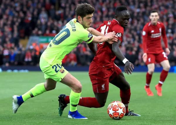 Sadio Mane (right) and Barcelona's Sergi Roberto