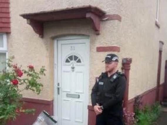 Police at the scene of the murder in Raven Street, Deepdale on Sunday, May 27.