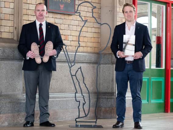 Lancashire County Councillor Alf Clempson and Rowley Greg, CEO of Remembered / There But Not There with the bootprints at Preston Train Station. Photo: Kelvin Stuttard