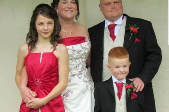 Lorraine and Martin Smythies, with Cameron and Chloe on their wedding day