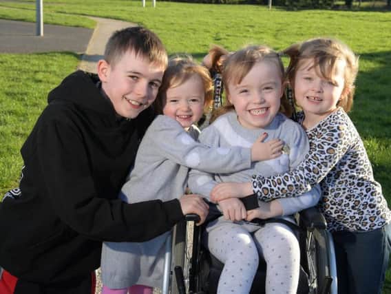 Caidi Gregson, 4, has cerebal palsy and hopes to raise 16,000 for an operation, pictured with Cian, Connie-Jayne and cousin Kylie