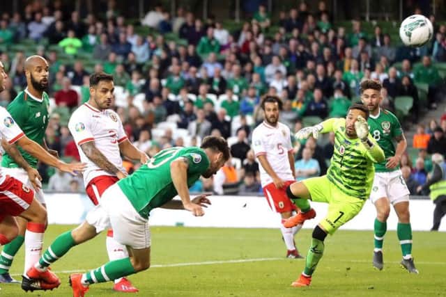 Sean Maguire (right) watches on as Robbie Brady heads Republic of Ireland's second goal against Gibraltar