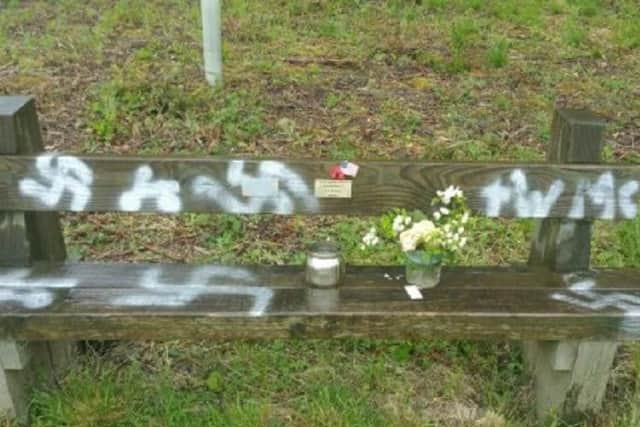 The commemorative bench which has been spray painted