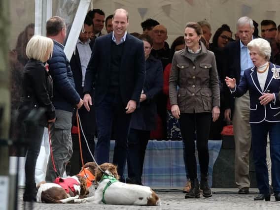 Prince William, Duke of Cambridge and Catherine, Duchess of Cambridge arrive at Keswick Market  (Photo by Ian Forsyth/Getty Images)