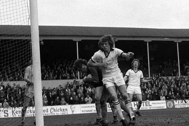Preston striker Barrie Mitchell challenges the Chester goalkeeper at Deepdale in February 1977
