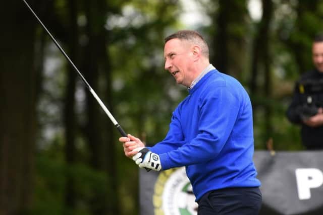 Former PNE skipper Ian Bryson plays a shot at the North West Former Players Association golf day