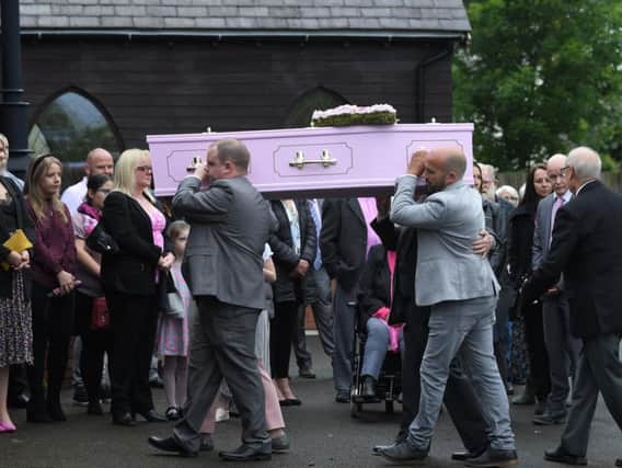 Sadie Wright's coffin is carried into the chapel