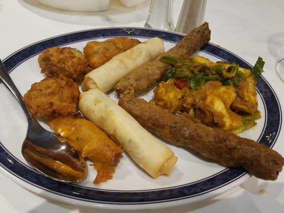 Starter plate of Chicken Pakora, Duck Rolls, Shish Kebab, Monk Fish, and Onion Bhajis