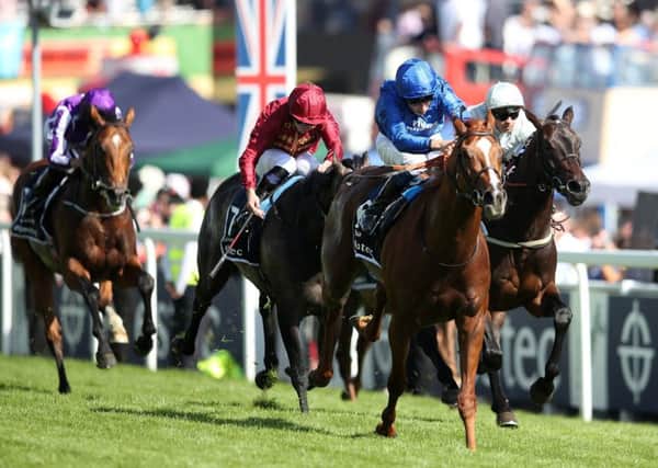 Masar ridden by jockey William Buick coming home to win the Derby in 2018 at Epsom Downs