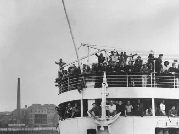June 22 1948:  The ex-troopship 'Empire Windrush' arriving at Tilbury Docks from Jamaica, with 482 Jamaicans on board, emigrating to Britain.  (Photo by Keystone/Getty Images)