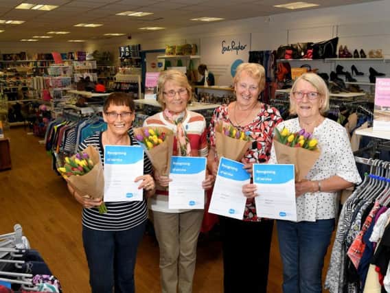 Volunteers Pat Southern, Helen Smyth, Sandra Coates and Marilyn Jones with their five year awards at Sue Ryder store, Tulketh Mill, Preston