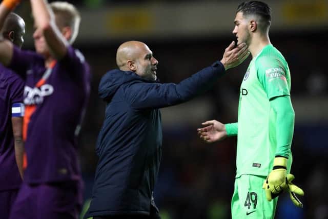 Manchester City goalkeeper Arijanet Muric is congratulated by Pep Guardiola after a Carabao Cup game at Oxford United last season