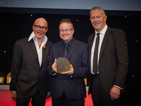 Leyland's Worden Academy business manager Mark Reed collected his TES Award from comedian Harry Hill at a glittering gala event in London'a Park Lane