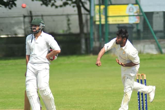 Penwortham's Rajdeep Maji bowls against Preston at West Cliff