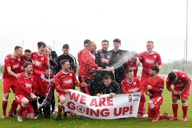 Longridge Town celebrate winning the North West Counties League First Division North title in April