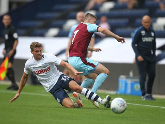 Calum Woods makes a tackle in last year's pre-season friendly against Burnley at Deepdale
