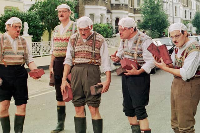 Terry Jones, John Cleese, Michael Palin, Terry Gilliam and Eddie Izzard dressed as Gumbies