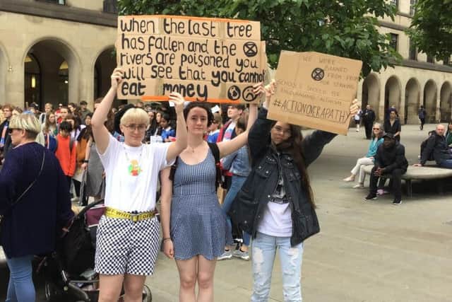 The trio protesting in Manchester