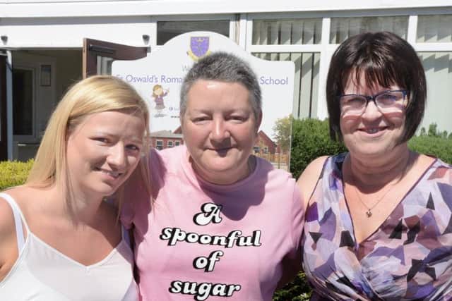 Grandma Dot Eatough thanks St Oswalds RC Primary School staff, Mrs Michelle Quigley, left and Mrs Elizabeth Green, right, after they went to help her when she collapsed whilst picking up her grandchildren from the school (JPIMedia)