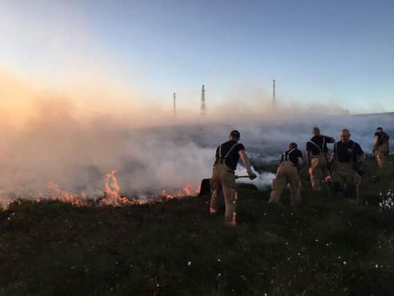Firefighters at the height of the Rivington blaze last year
