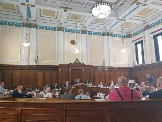 A proposal to take new steps in tackling racial and religious hate crime in Preston was postponed at a council meeting.