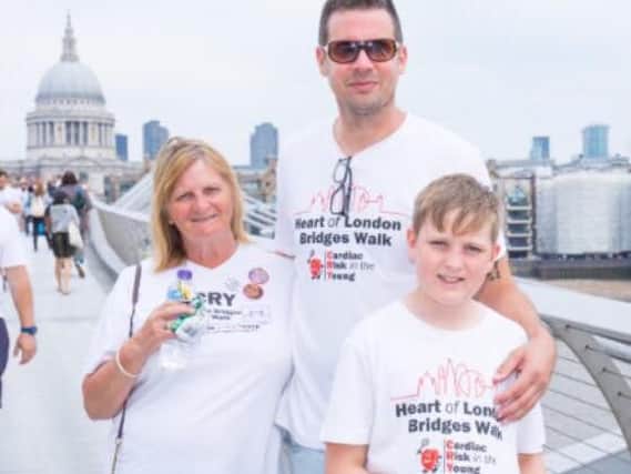 Viv Christopher, of Eccleston, did the Heart of London Bridges Walk for CRY. She is pictured with her son-in-law James Webber and grandson Freddy