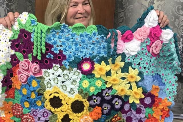 Kay Carson with one of her flower creations