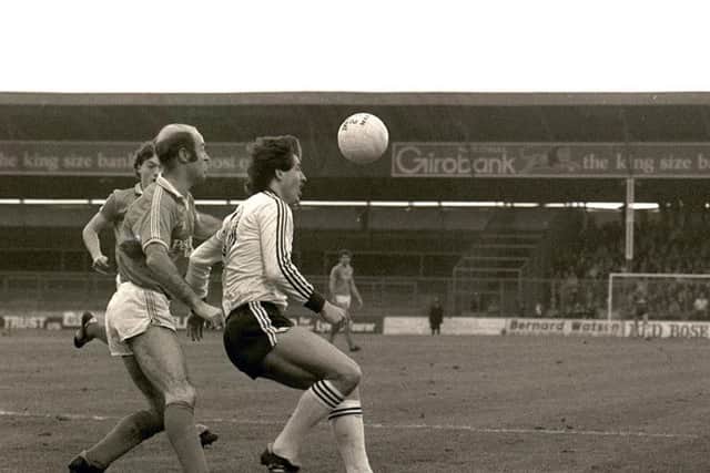 Preston winger Willie Naughton shields the ball against Blackpool in 1982