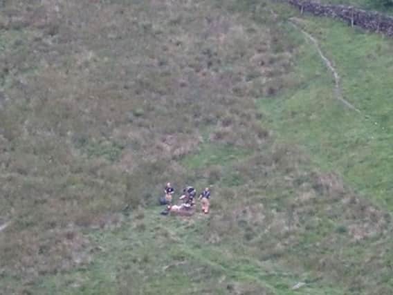 Firefighters with a barbeque that was being used on Saddleworth Moor