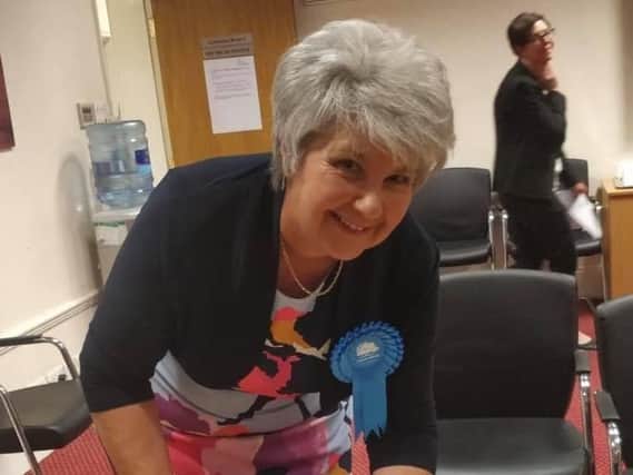 Cllr Valerie Caunce, widow of the late Cllr Henry Caunce, signs the register after being elected to the seat which he held for 15 years
