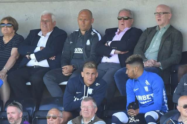 PNE manager Alex Neil watches the action from the stand with advisor Peter Ridsdale and chief executive John Kay