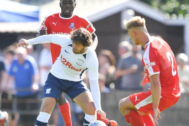 PNE midfielder Ben Pearson competes for possession against Bamber Bridge