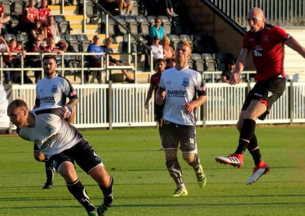 Kevin Ellison in action during last years pre-season trip to Bamber Bridge, whom the Shrimps visit on Saturday