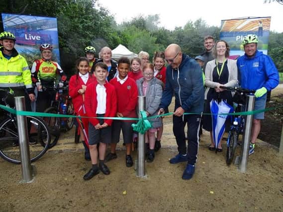 The first of South Ribbles Green Links pathways was officially opened by CounMick Titherington. Pictured: Coun Titherington, Walton-le-Dale Primary School Year 5 pupils, Outram House residents, Jennifer Mullin (South Ribble assistant director) and South Ribbles Sports Development & Projects team members