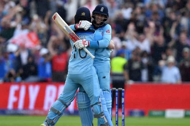 England's captain Eoin Morgan (l) and England's Joe Root celebrate victory during the 2019 Cricket World Cup second semi-final between England and Australia