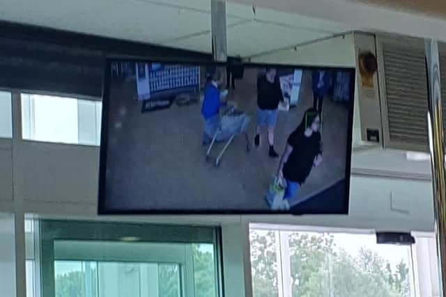 A screen in stores shows a live feed from the CCTV camera