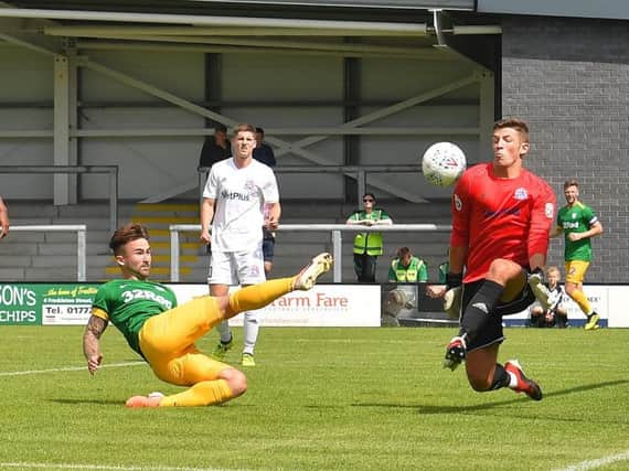 Sean Maguire hooks Preston in front at AFC Fylde