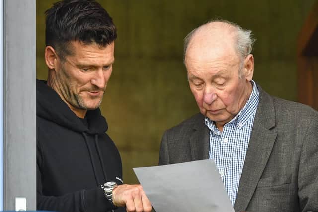 David Nugent and Trevor Hemmings read the team sheet