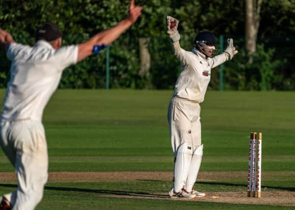 Garstang's Matt Crowther stumps Fleetwood's James Amor (photo: Tim Gilbert/Preston Photographic Society)